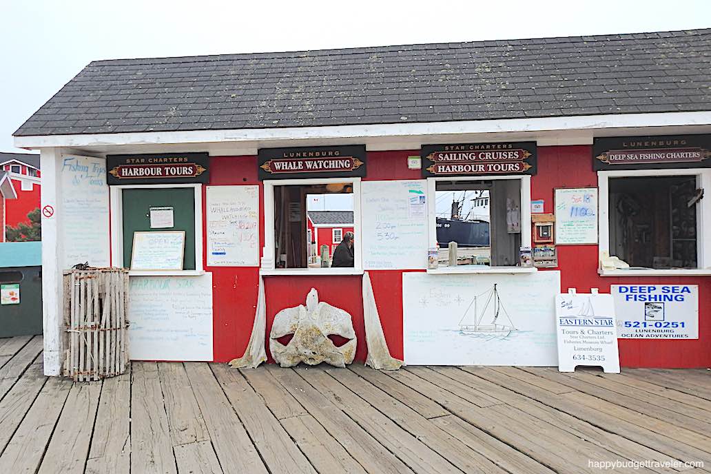 Picture of some of the activities available on the boardwalk of Lunenburg Harbor, Nova Scotia