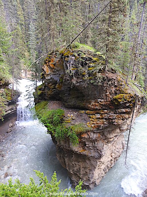 Picture of a boulder that Cavern Falls has carved a path around, Johnston Canyon, Banff-Canada