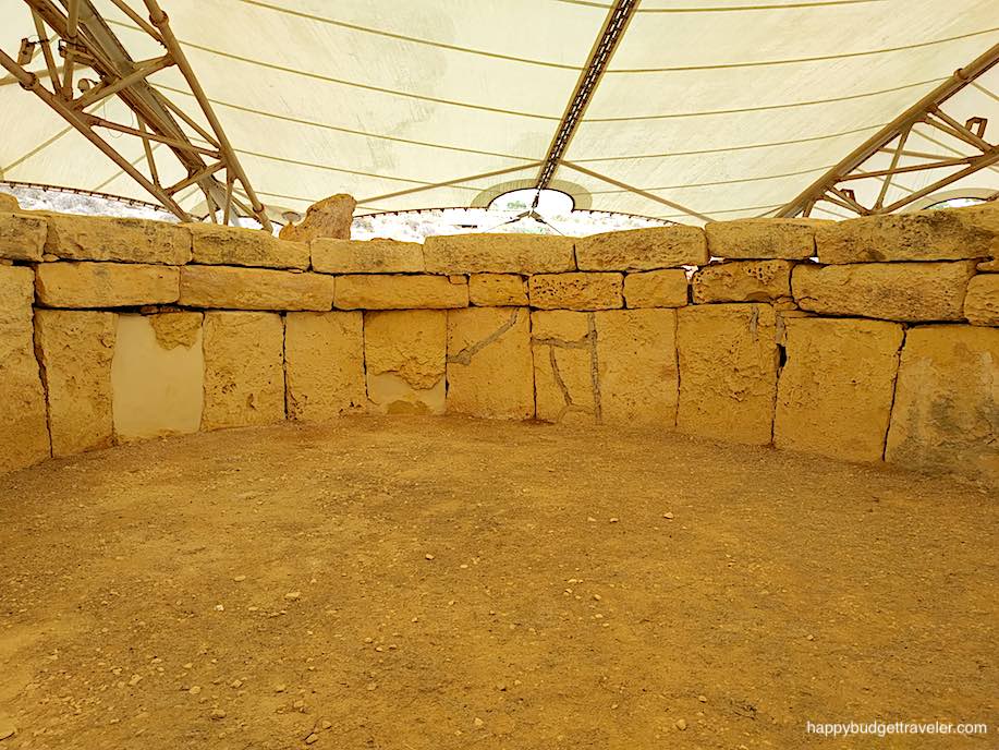 Picture of an Aspe with huge blocks of stone separating it from the next chamber. Hagar Qim, Malta