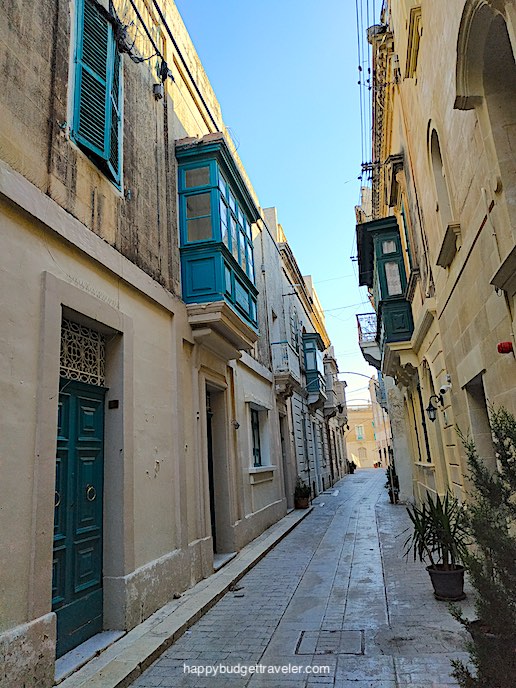 Picture of typical Maltese-style balconies and narrow pathways between houses within the walled-city of Mdina, Malta